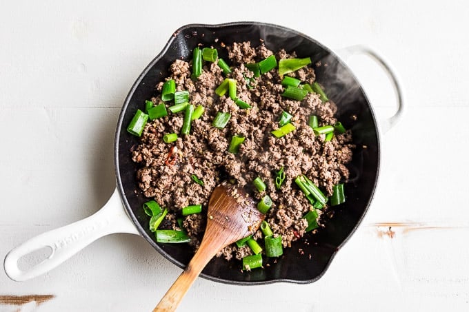 Adding the green onions last to the Mongolian Beef Stir Fry!