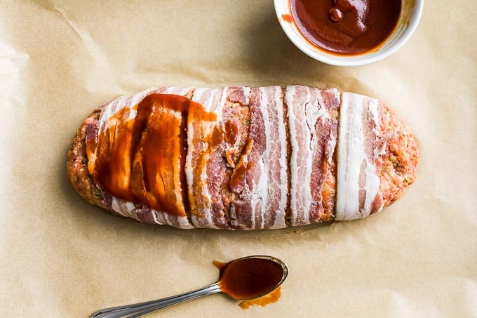 Bacon wrapped meatloaf prepped with the glaze going on!