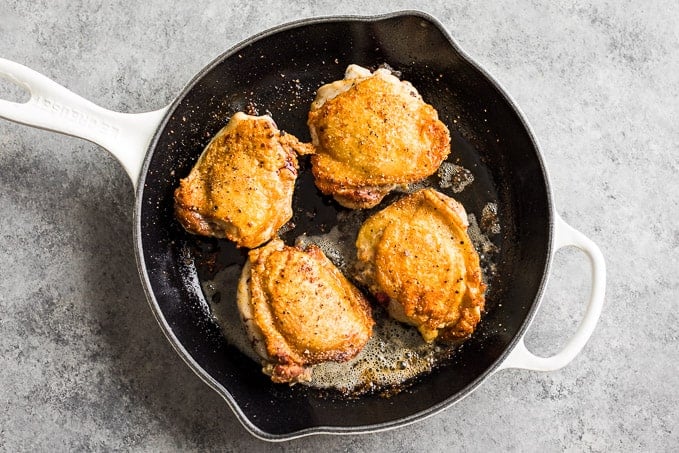 Pan fried crispy chicken thighs.