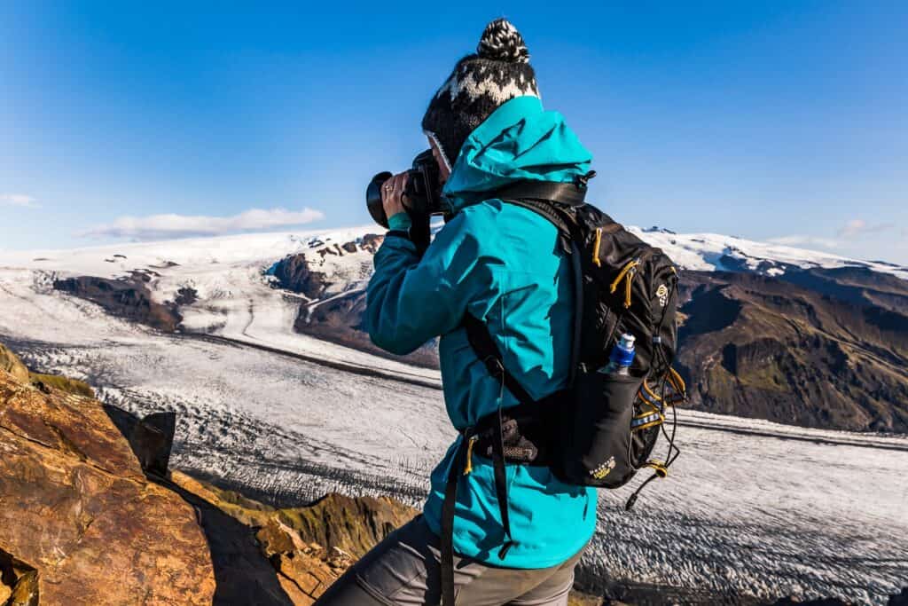 Kari taking a photo of a Glacier in Iceland