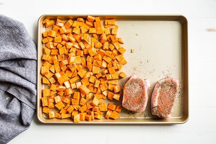 The sweet potatoes get roasted first before adding the rest of this sheet pan dinner!