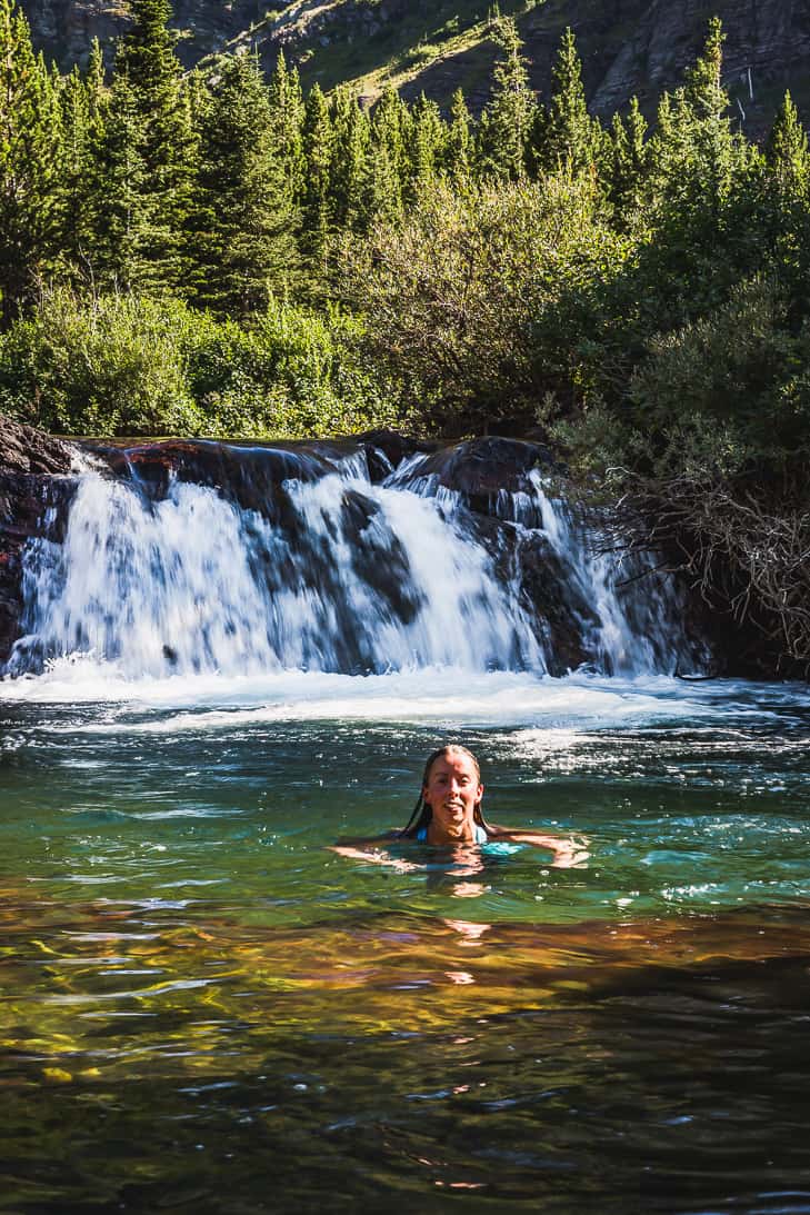Swimming in Red Rock Falls at the end of our Swiftcurrent Pass hike!