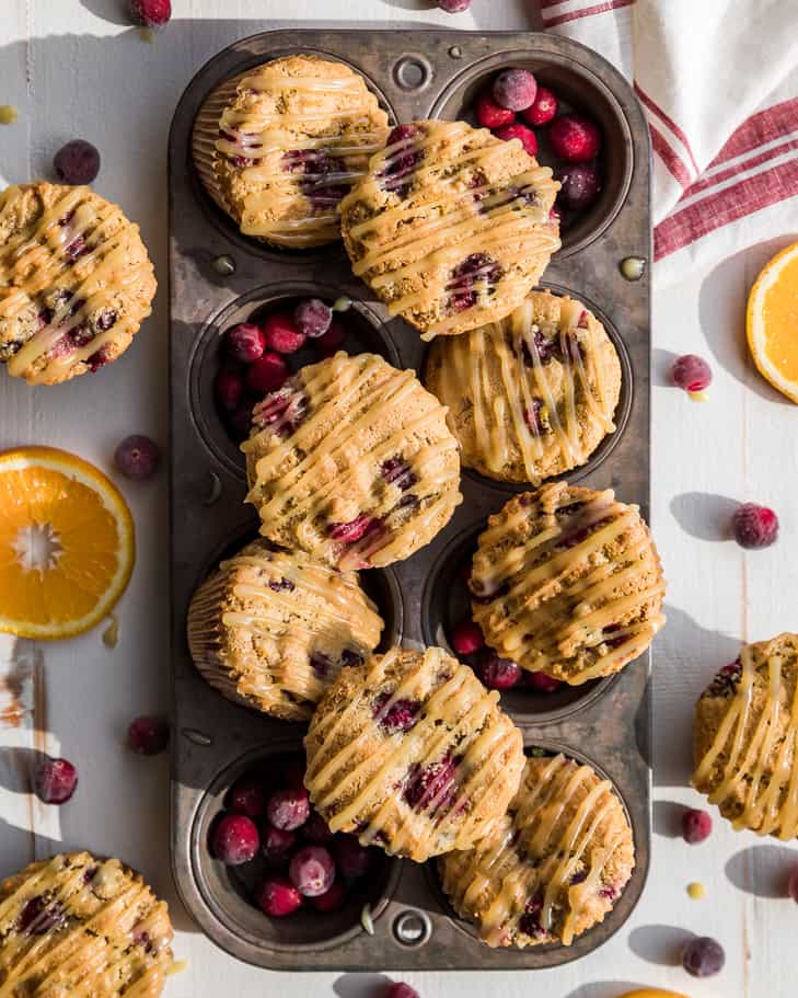 Paleo Cranberry Orange Muffins piled into a muffin tin.