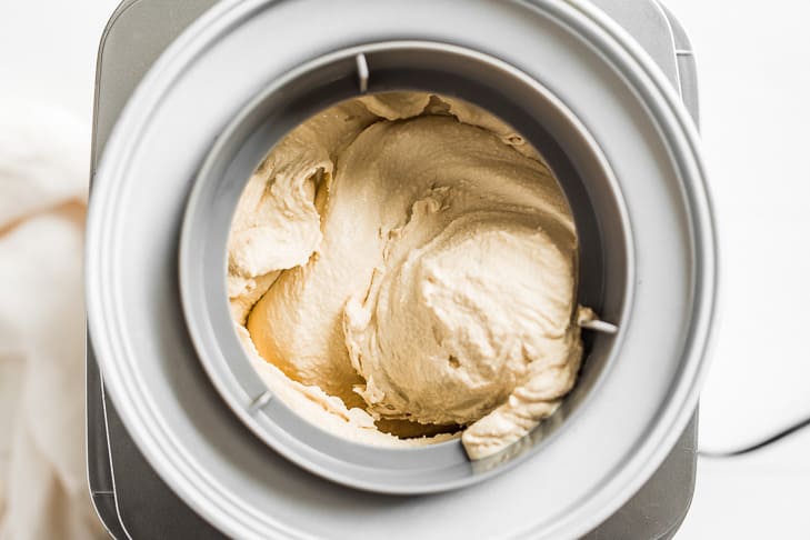 Maple ice cream freezing in an ice cream machine.