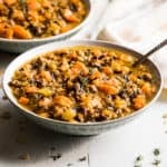 Bowls of Chicken and Wild Rice Soup with Crackers.