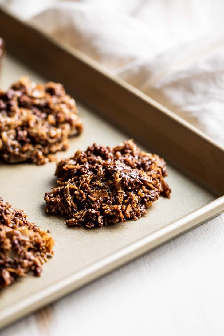 Chocolate Chunk Salted Caramel No Bake Cookies on a gold baking sheet.