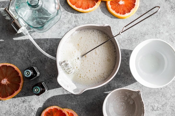 The ingredients for the Grapefruit Ginger Body Wash mixed together in a bowl.