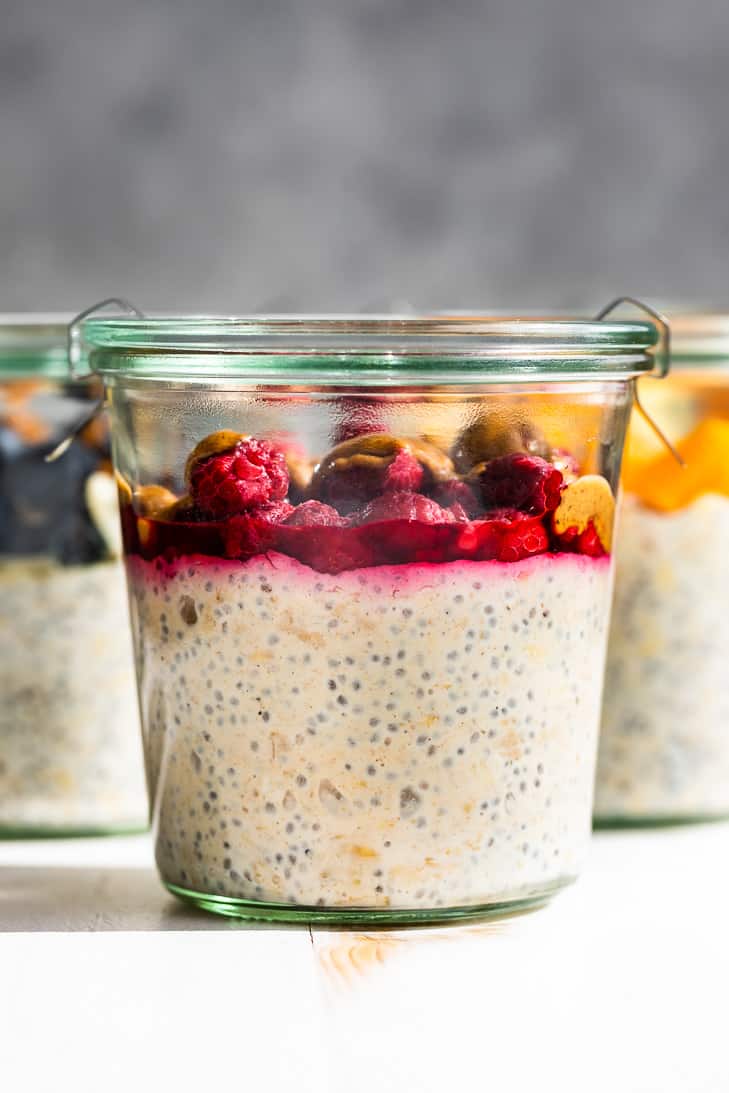 PBJ overnight oats in the front with blueberry almond and tropical oats in the background.