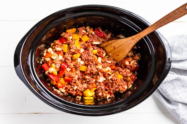 The salsa being mixed in to the ground beef and onion mixture.