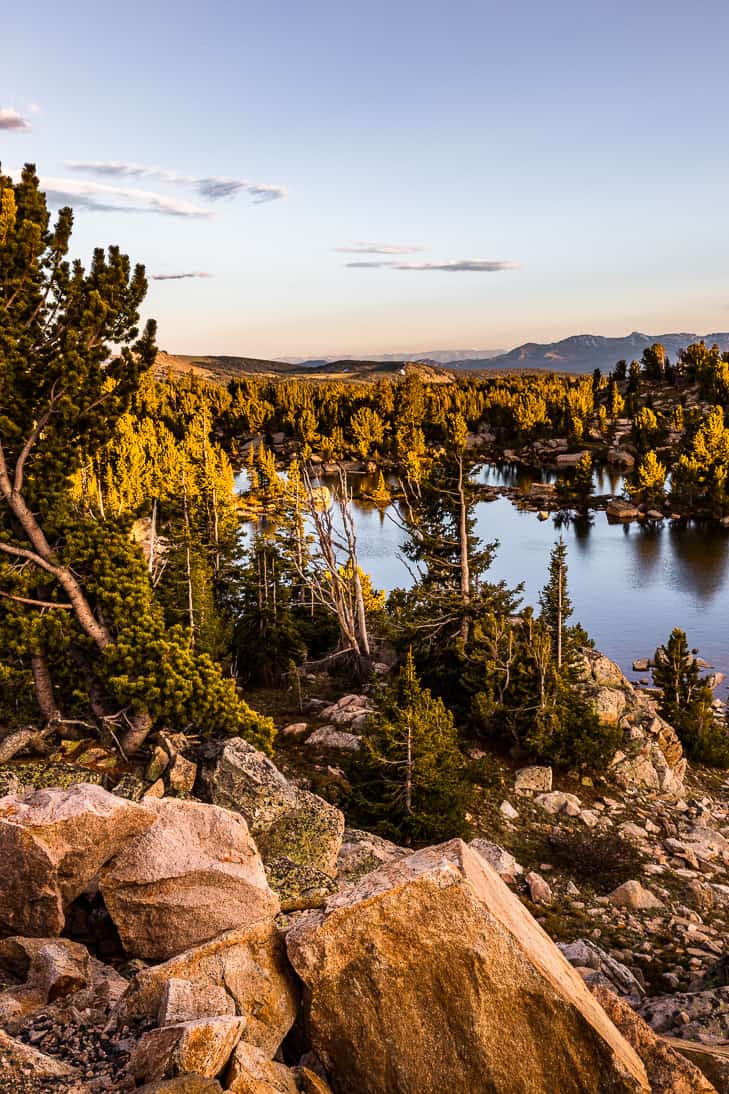 View of an unnamed lake on the side of the Beartooth Highway at sunset.