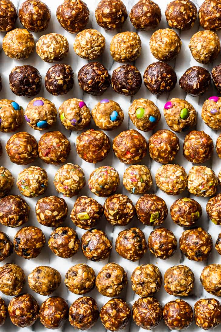 10 Flavors of the No Bake Energy Bites laid out in horizontal rows on a white background.