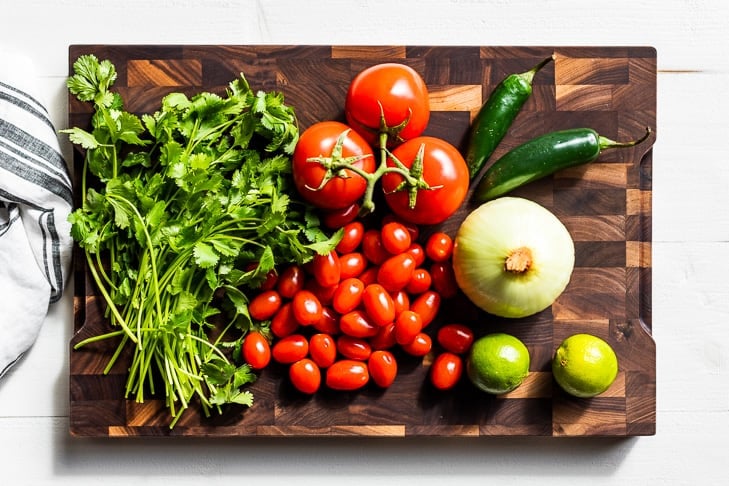 All the ingredients for this recipe on a wooden cutting board.