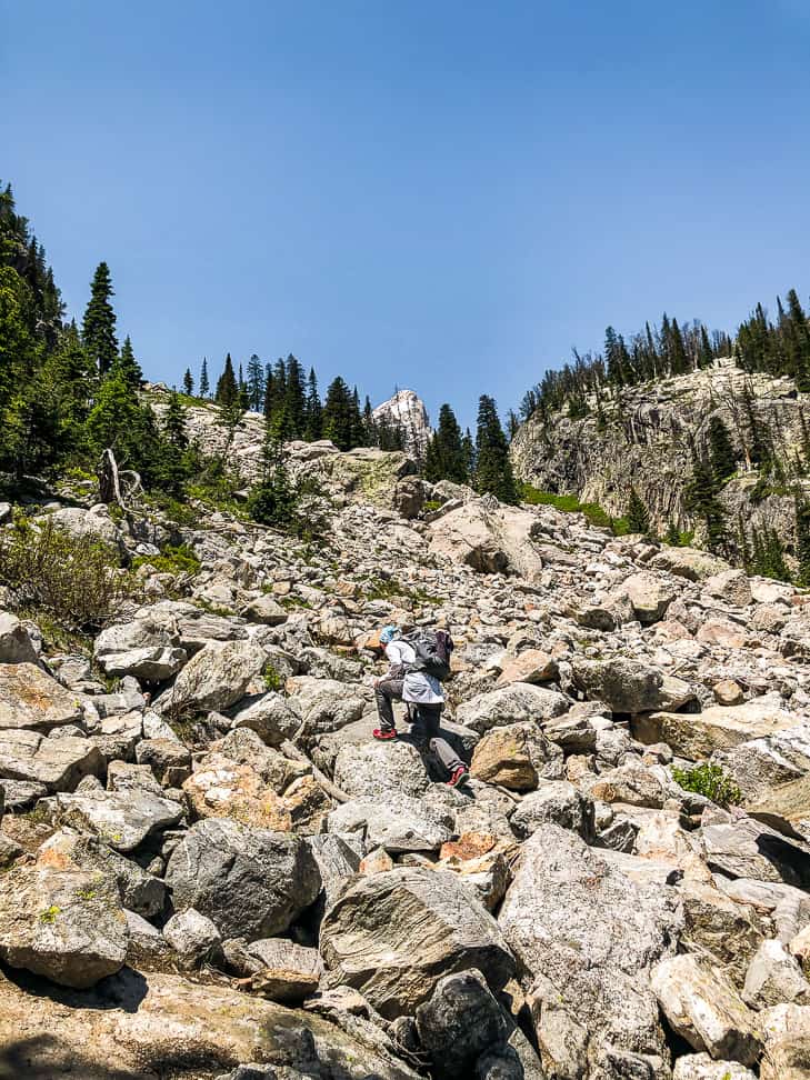 The boulder field just below Deltal Lake with a hiker in the middle of it.