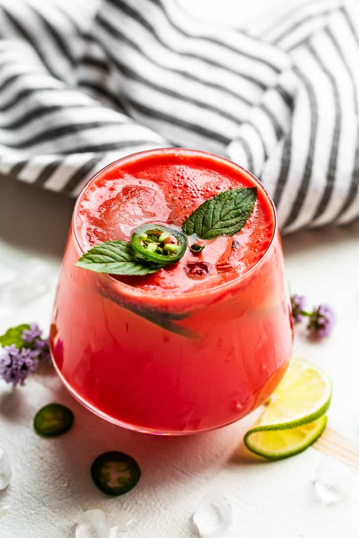 Watermelon Kombucha Mocktail topped with a jalapeno slice and mint.