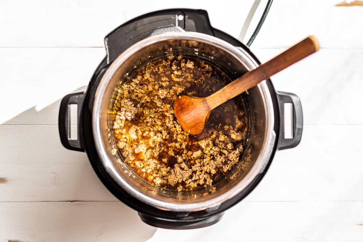 Sautéed ground turkey, ginger, and garlic in an instant pot.