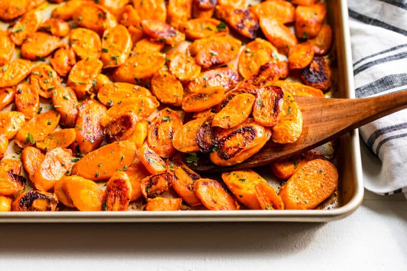 Finished Roasted Carrots on a gold sheet pan.