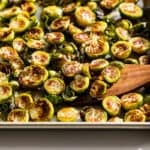 Finished browned Brussels sprouts on a baking sheet.
