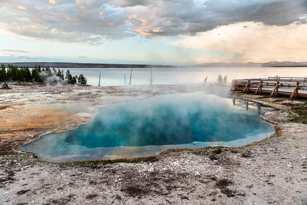 Overlooking a second bright blue geyser from the West Thumb Basin at sunset.