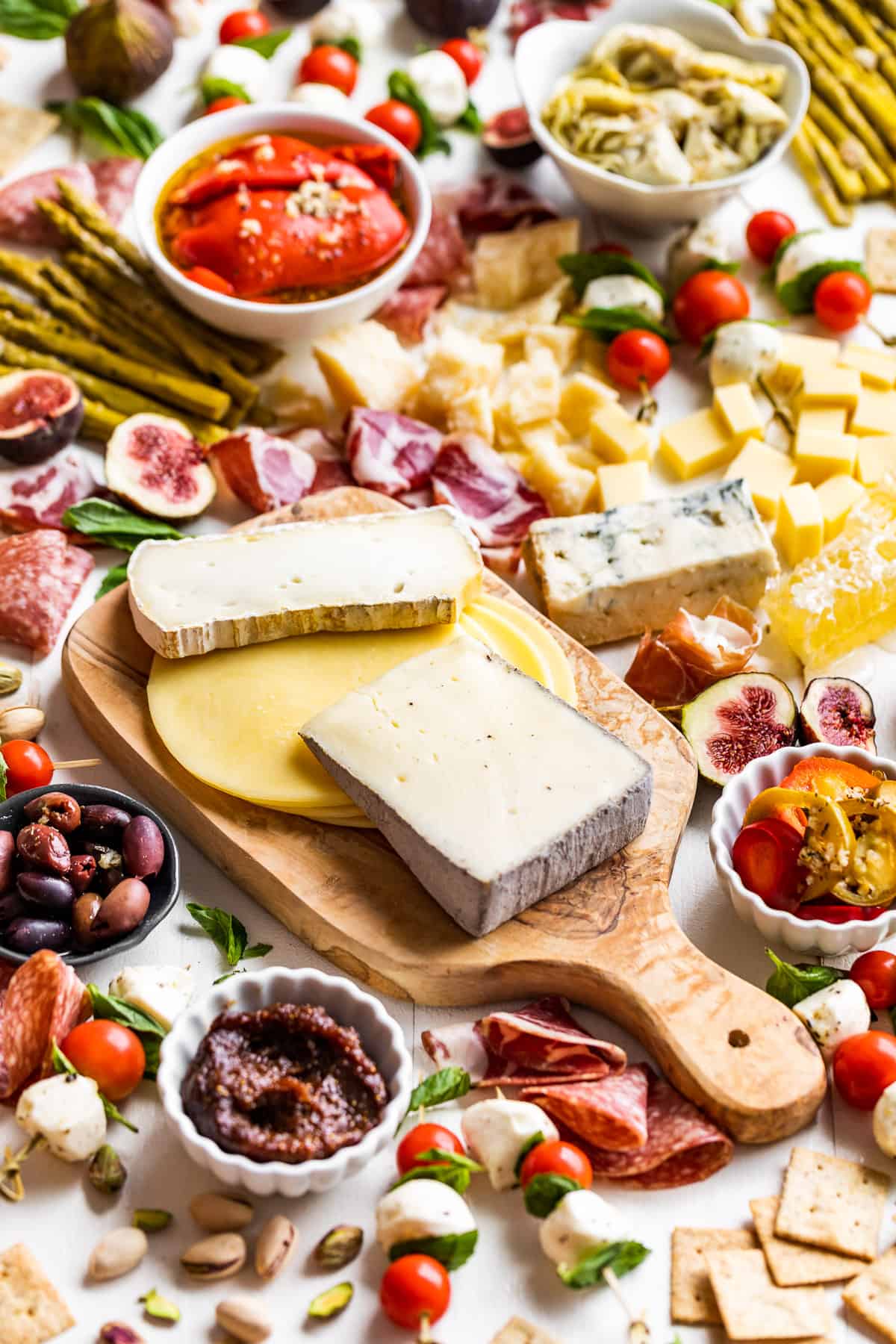 Straight down view of a large Antipasto Platter laid out on a white board.