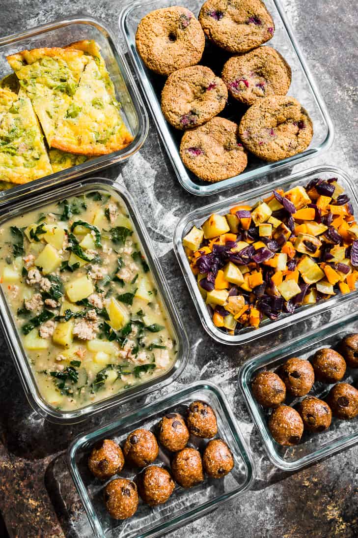 Meal prep in glass containers, egg bake, muffins, and Zuppa Toscana.