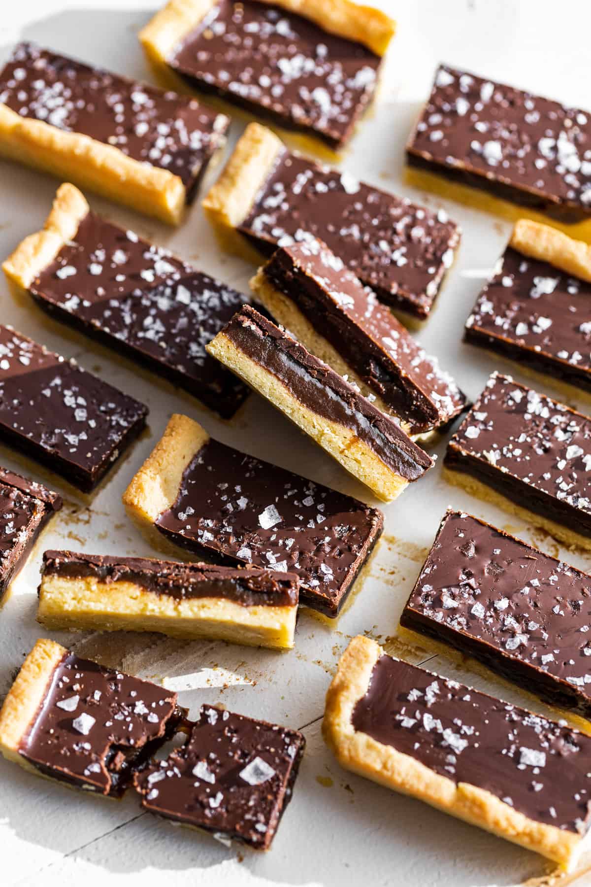 Side view of cut Twix bars with sea salt on top.