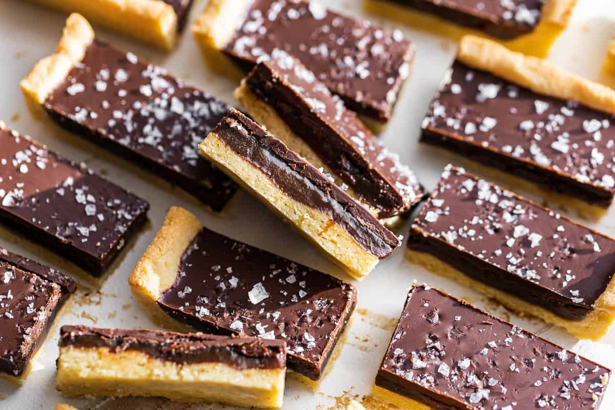 Side view of sliced Twix Bars sprinkled with sea salt.