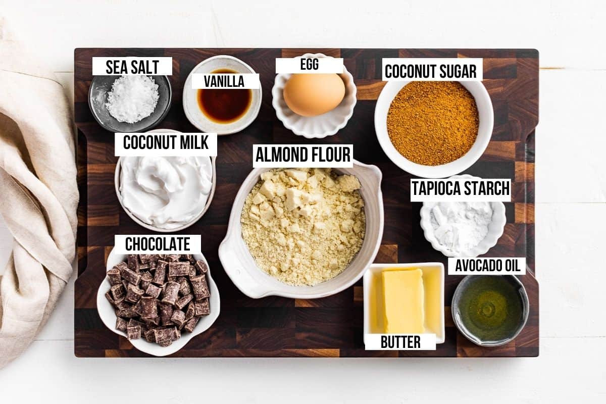 All the ingredients measured out, coconut sugar, almond flour, chocolate chunks, coconut cream, vanilla, butter etc..