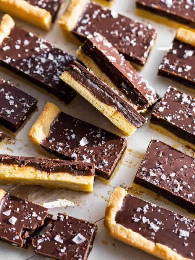 Side view of cut Twix bars with sea salt on top.