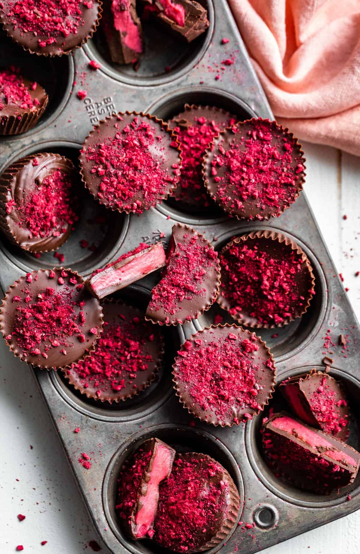 Straight down view of Chocolate Raspberry Candies piled into a vintage muffin tin.