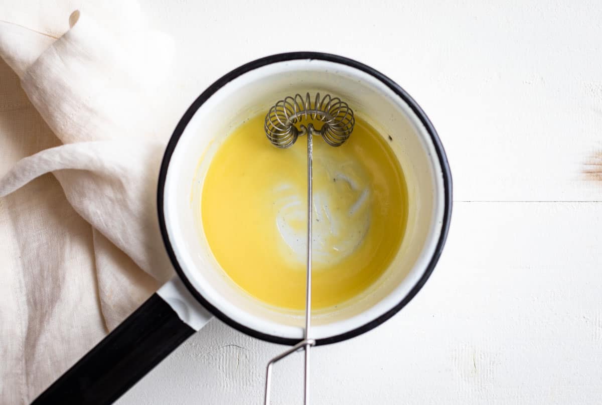 Melted butter whisked together with gluten free flour to make a roux.