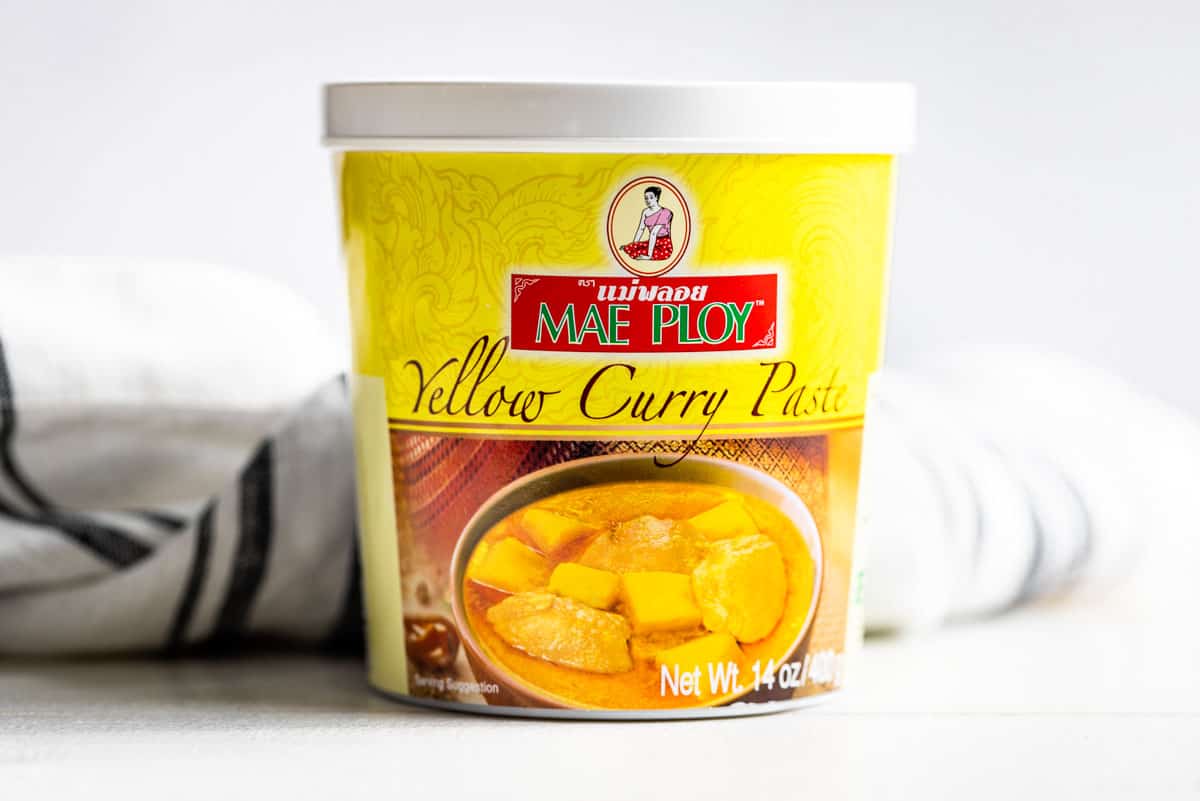 Mae Ploy curry past container on a white background.