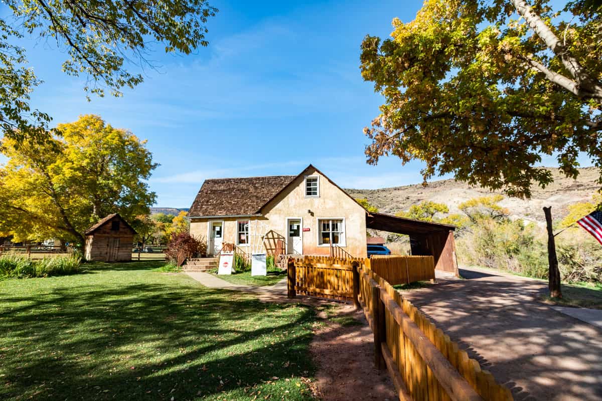 The historic Gifford House in Capitol Reef National Park surrounded by trees in early fall.