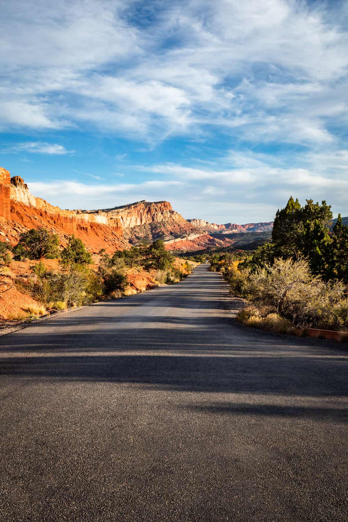 View down the middle of the road looking in the distance of the scenic drive in Capitol Reef.