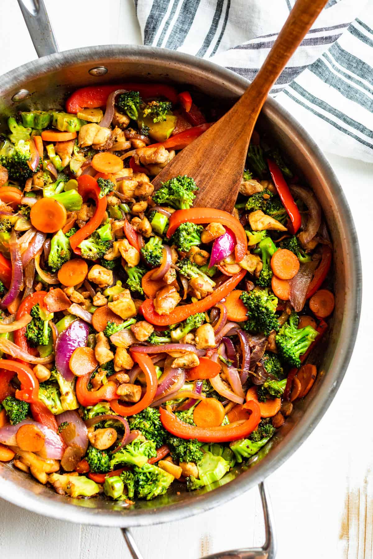 Straight down view of finished Chicken Stir Fry in a large stainless steel skillet.