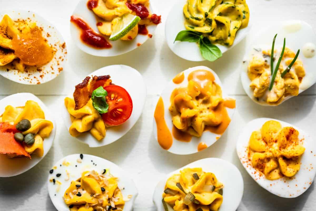 All 10 flavors of Deviled Eggs on a white background.