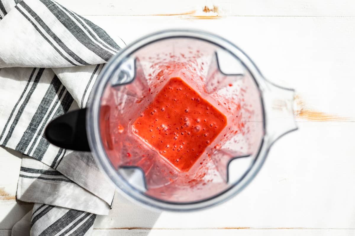 The finished Strawberry Vinaigrette with the oil added in a blender container.