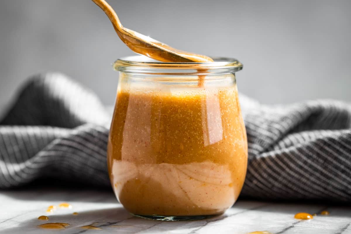 Finished Honey Mustard Sauce in a glass jar.