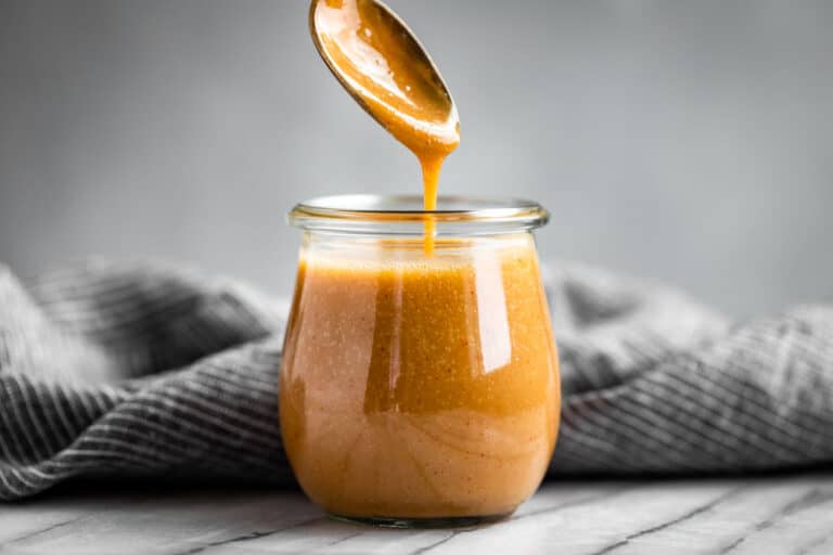 Finished Honey Mustard Sauce in a glass jar.