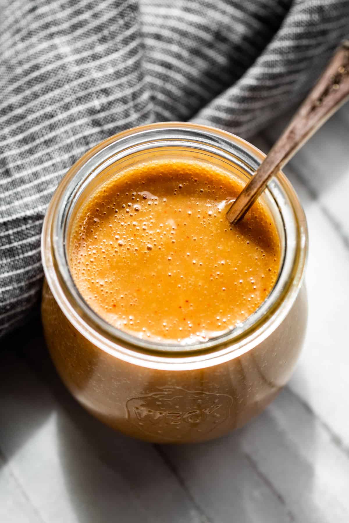 Straight down view of the Honey Mustard Sauce in a glass jar.