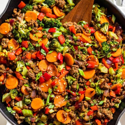 Straight down view of the finished Ground Beef Stir Fry in a large white skillet.