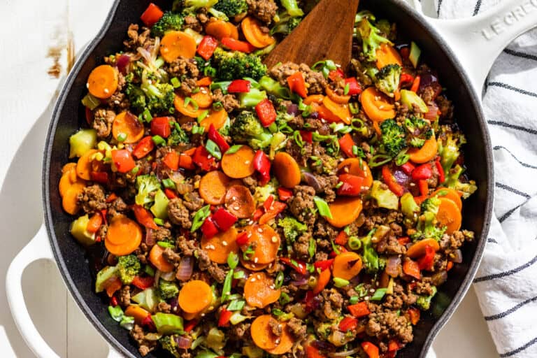 Straight down view of the finished Ground Beef Stir Fry in a large white skillet.