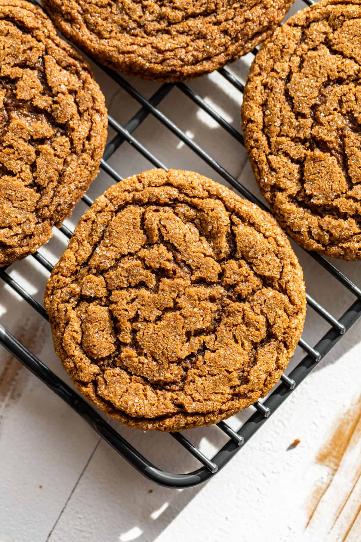 Downwards view of Molasses Ginger Cookies on a cooling rack.