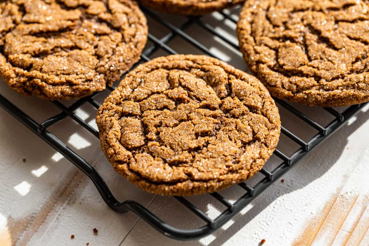 Molasses Ginger Cookies on a wire cooling rack.