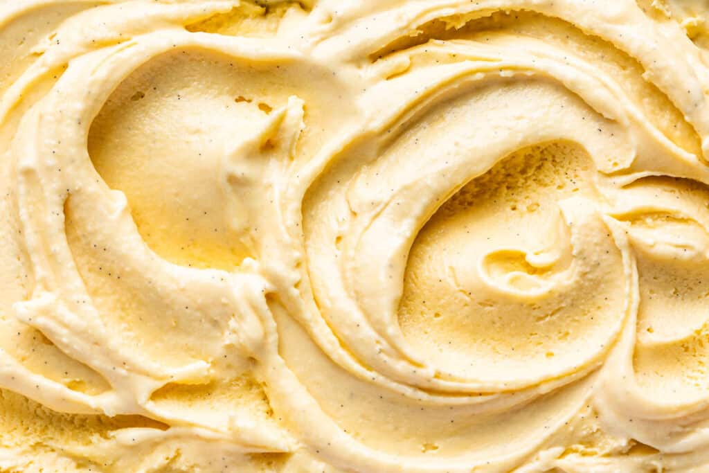 Close macro view of soft serve vanilla ice cream.