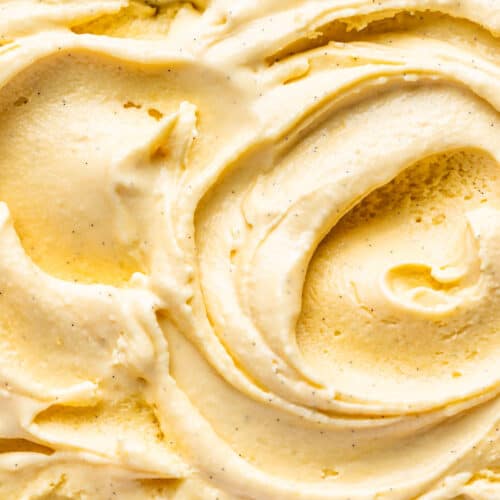 Close macro view of soft serve vanilla ice cream.