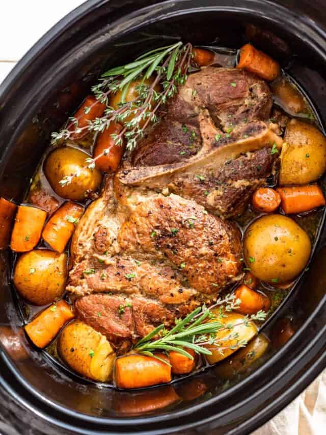 Downwards view of Slow Cooker Pork Roast with potatoes and carrots in the slow cooker bowl.
