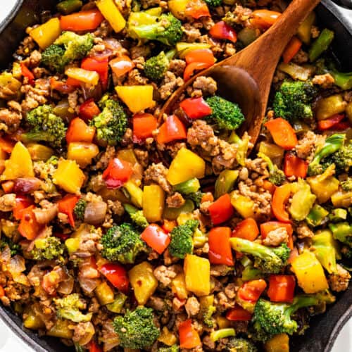 Straight down view of Ground Pork Stir Fry in a white skillet.