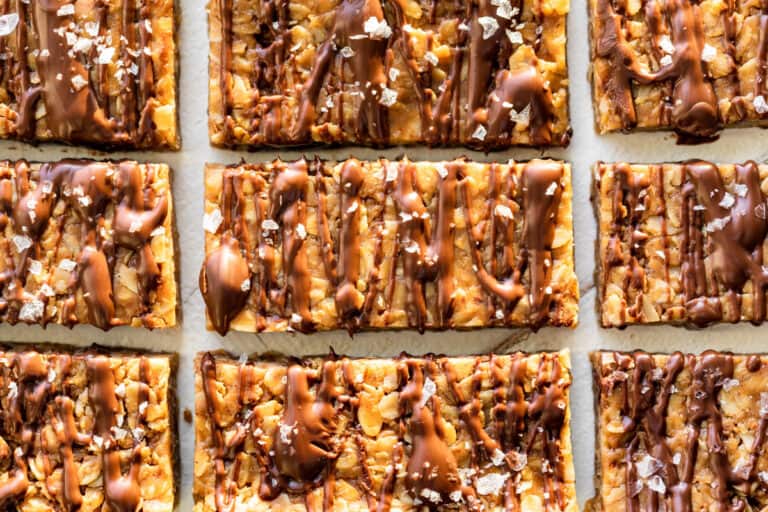 Finished Peanut Butter Granola Bars drizzled with chocolate and sprinkled with sea salt.