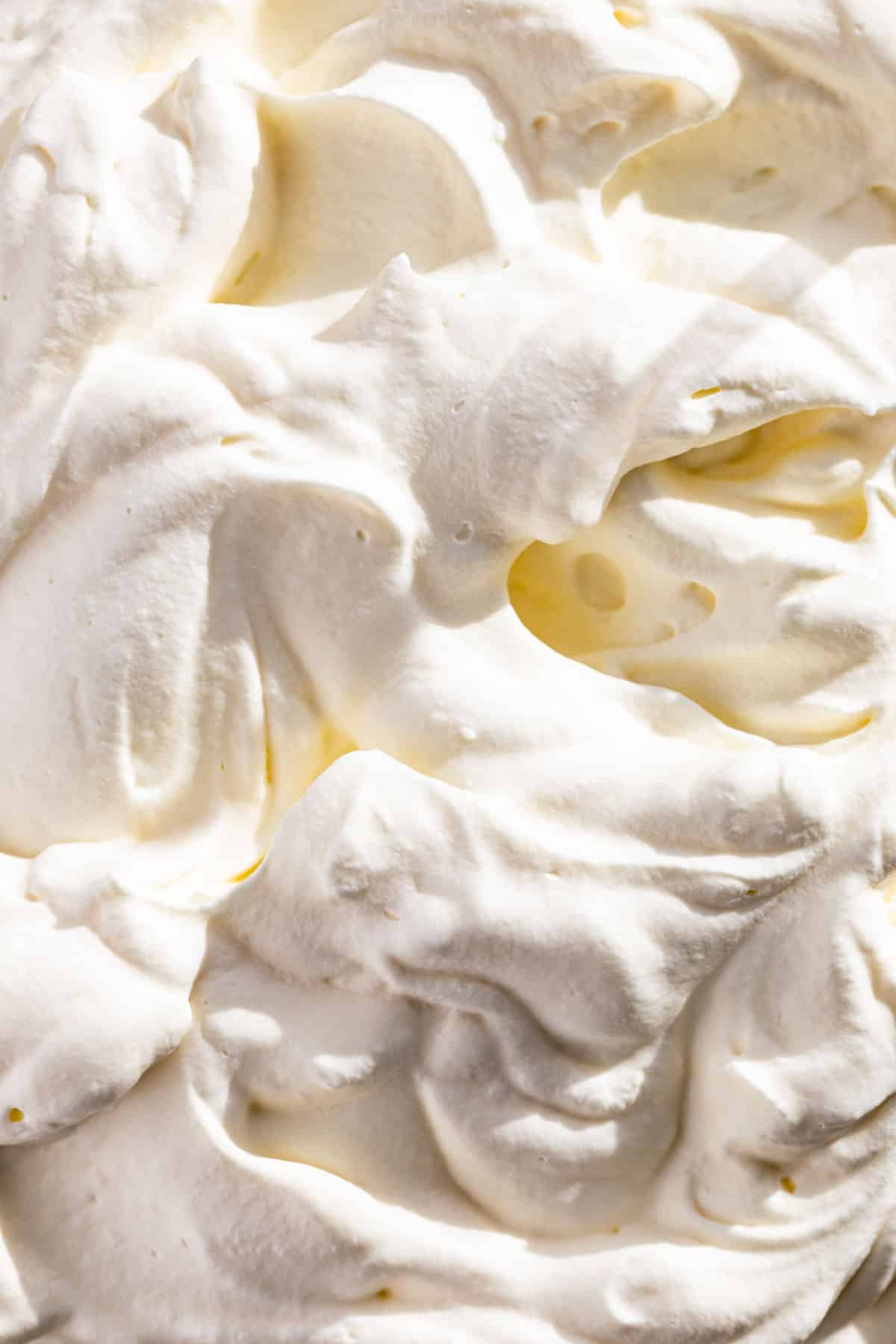 Close macro view of swirls of whipped cream.