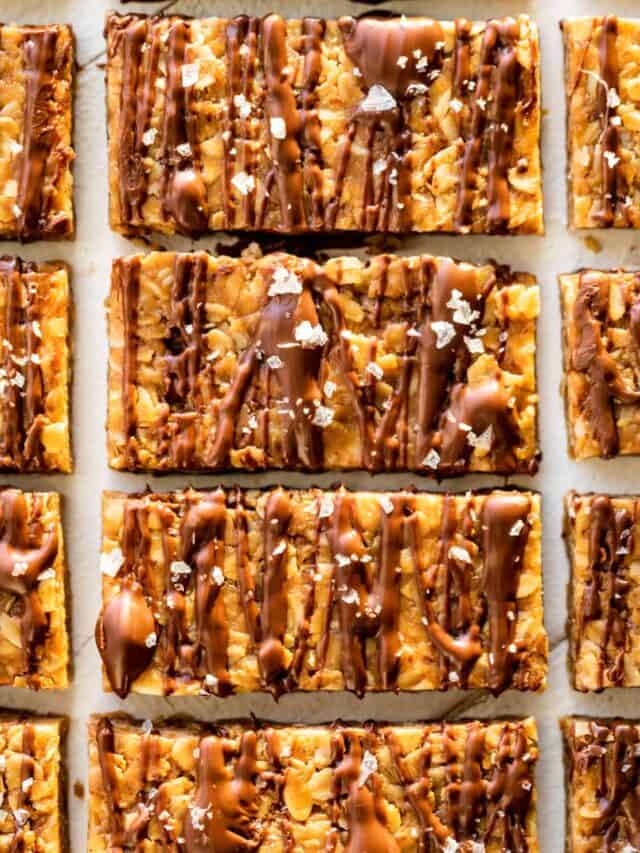 Straight down view of Peanut Butter Granola Bars drizzled with chocolate and sprinkled with sea salt.